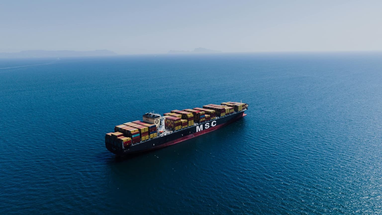 Containers being unloaded from a ship at Chittagong port, Bangladesh
