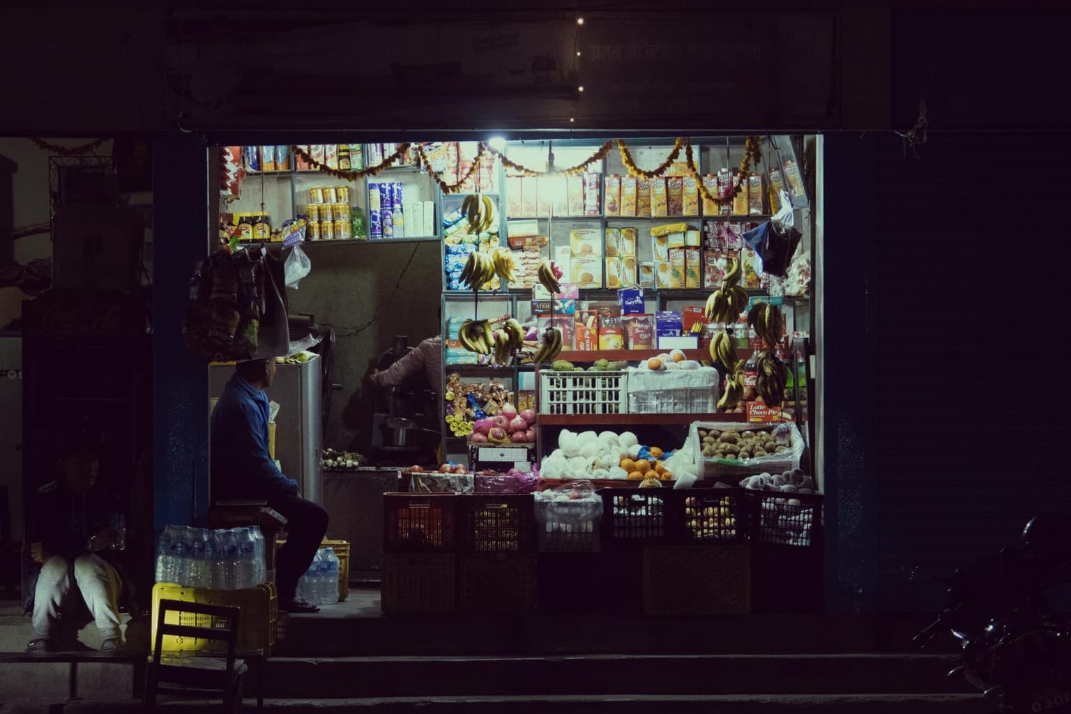 A mudi shop in Dhaka with fresh produce on display at the front
